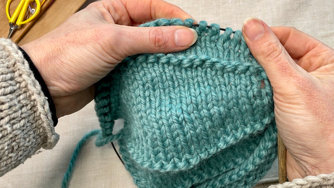 hands holding knitting