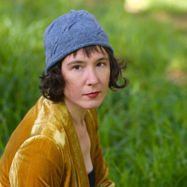 Carol Feller wearing her Mau Hat knitting design 