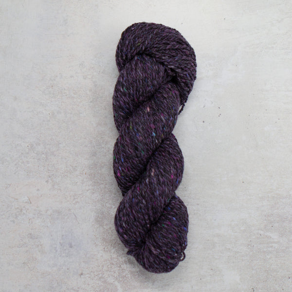 Purple yarn with flecks of colours