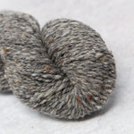 close up of grey yarn with flecks