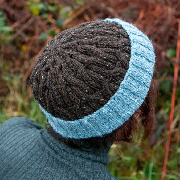 brown and blue cable hat