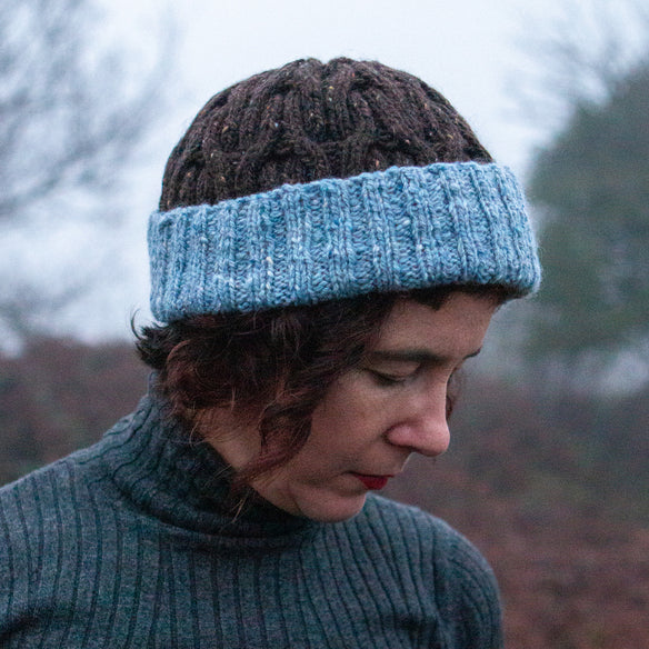 brown and blue cable hat